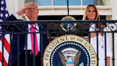 Trump and Melania stand for the National Anthem at a picnic for military families at the White House, Friday, July 4, 2025, in Washington. AP/PTI(AP07_05_2025_000046B) (AP) Trump and Melania stand for the National Anthem at a picnic for military families at the White House, Friday, July 4, 2025, in Washington. AP/PTI(AP07_05_2025_000046B) (AP)