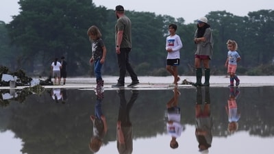 People are advised to stay away from flooded roadways for safety concerns, stating that "most flood deaths occur in vehicles," "be aware of your surroundings," and "be especially cautious at night." (AP)