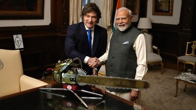 Handout picture released by the Argentinian Presidency showing India's Prime Minister Narendra Modi (R) and Argentina's President Javier Milei posing for a picture behind a chainsaw reading "The Forces of Heaven" during a meeting at Casa Rosada government palace in Buenos Aires on July 5, 2025. (AFP) Handout picture released by the Argentinian Presidency showing India's Prime Minister Narendra Modi (R) and Argentina's President Javier Milei posing for a picture behind a chainsaw reading "The Forces of Heaven" during a meeting at Casa Rosada government palace in Buenos Aires on July 5, 2025. (AFP)