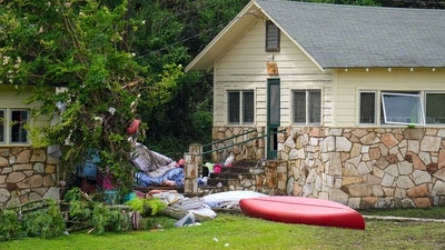 Items are seen outside sleeping quarters at Camp Mystic along the banks of the Guadalupe River after a flash flood swept through the area Saturday, July 5, 2025, in Hunt, Texas. (AP Photo/Julio Cortez) (AP) Items are seen outside sleeping quarters at Camp Mystic along the banks of the Guadalupe River after a flash flood swept through the area Saturday, July 5, 2025, in Hunt, Texas. (AP Photo/Julio Cortez) (AP)