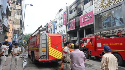 Firefighters carry out cooling operations at Vishal Mega Mart in Karol Bagh in central Delhi on Saturday. (Sonu Mehta/HT Photo) Firefighters carry out cooling operations at Vishal Mega Mart in Karol Bagh in central Delhi on Saturday. (Sonu Mehta/HT Photo)
