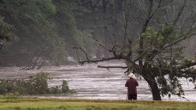 After the Texas floods wreaked havoc in the area, an elderly resident stands amid the devastation caused. (Eric Vryn/AFP) After the Texas floods wreaked havoc in the area, an elderly resident stands amid the devastation caused. (Eric Vryn/AFP)