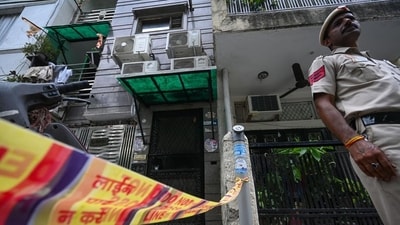 Police officials seen outside the house where the murder took place. (Sanchit Khanna/Hindustan Times) Police officials seen outside the house where the murder took place. (Sanchit Khanna/Hindustan Times)