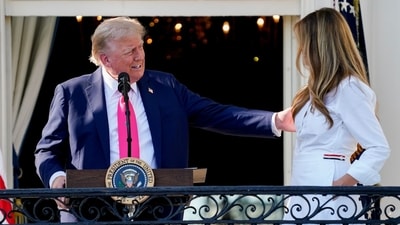 US President Donald Trump, left, and First Lady Melania Trump during a signing ceremony for the One Big Beautiful Bill Act on the South Lawn of the White House in Washington, DC, US, on Friday, July 4, 2025. (Bloomberg) US President Donald Trump, left, and First Lady Melania Trump during a signing ceremony for the One Big Beautiful Bill Act on the South Lawn of the White House in Washington, DC, US, on Friday, July 4, 2025. (Bloomberg)