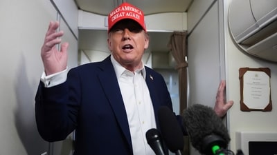 President Donald Trump speaks to reporters on board Air Force One amid July 4 celebrations (AP) President Donald Trump speaks to reporters on board Air Force One amid July 4 celebrations (AP)