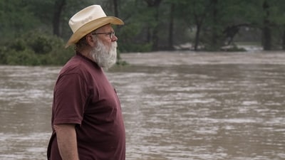 Comfort resident Reagan Arnold observes rising water levels near his home along the Guadalupe River on July 4, 2025 in Comfort, Texas.&nbsp; (Getty Images via AFP)