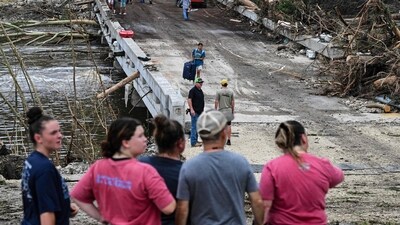 People look on as law enforcement and volunteers continue to search for missing people near Camp Mystic, the site of where at least 20 girls went missing after flash flooding in Hunt, Texas, on July 5, 2025. (AFP) People look on as law enforcement and volunteers continue to search for missing people near Camp Mystic, the site of where at least 20 girls went missing after flash flooding in Hunt, Texas, on July 5, 2025. (AFP)