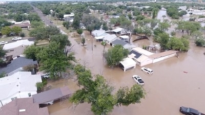 A drone view shows flooded houses, following torrential rains that unleashed flash floods along the Guadalupe River in San Angelo, Texas, U.S., June 4, 2025, in this screen grab obtained from a social media video. Patrick Keely via REUTERS    THIS IMAGE HAS BEEN SUPPLIED BY A THIRD PARTY. MANDATORY CREDIT. NO RESALES. NO ARCHIVES.     TPX IMAGES OF THE DAY (Patrick Keely via REUTERS)
