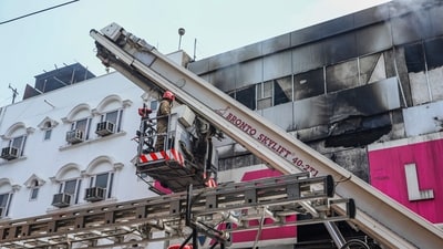 Fire personnel at a Vishal Mega Mart showroom, where a fire broke out on Friday, at Karol Bagh area, in New Delhi, Saturday, July 5, 2025. (PTI) Fire personnel at a Vishal Mega Mart showroom, where a fire broke out on Friday, at Karol Bagh area, in New Delhi, Saturday, July 5, 2025. (PTI)