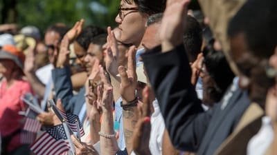 People stand and take the Naturalization Oath of Allegiance on Independence Day (AP) People stand and take the Naturalization Oath of Allegiance on Independence Day (AP)