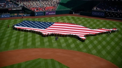 The American flag in the shape of the map of the United States is displayed on the before a baseball game between the Washington Nationals and the Boston Red Sox (AP) The American flag in the shape of the map of the United States is displayed on the before a baseball game between the Washington Nationals and the Boston Red Sox (AP)