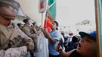 Protestors confront the Marines deployed outside federal buildings amid protests in Los Angeles (AP) Protestors confront the Marines deployed outside federal buildings amid protests in Los Angeles (AP)