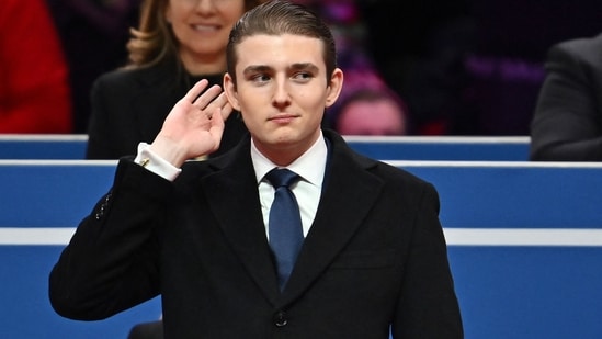 World Liberty Financial, co-founded by Barron Trump, has sold $550 million in tokens, boosting his net worth. (Photo by ANGELA WEISS / AFP) (AFP)