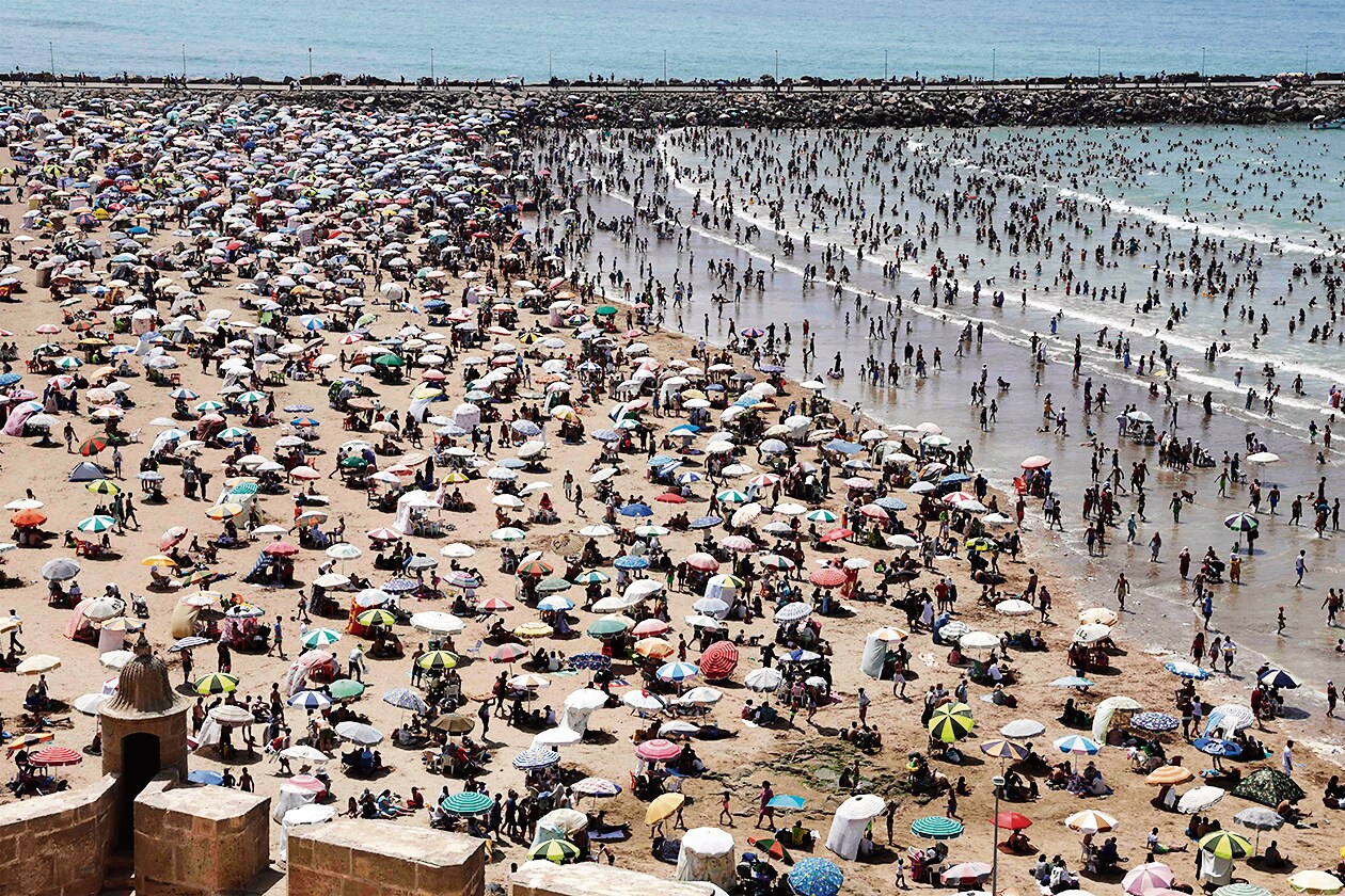 Crowds throng a beach in Sale, Morocco, during a heatwave. (AFP) Crowds throng a beach in Sale, Morocco, during a heatwave. (AFP)