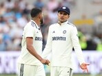 India's Shubman Gill speaks with Mohammed Siraj 