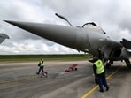 A French fighter aircraft Rafale M manufactured by Dassault Aviaition, stands on the tarmac before a practice session for a simulated landing on an aircraft carrier at the Landivisiau Navy Air Base (BAN Landivisiau) in Saint-Servais, Brittany, France, 
