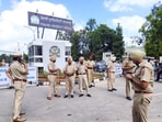 Police personnel stand guard during a protest in Patiala. Police personnel stand guard during a protest in Patiala.