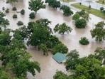 A CH-47 helicopter surveys the area, following flash flooding, in Kerrville, Texas