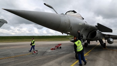 A French fighter aircraft Rafale M manufactured by Dassault Aviaition, stands on the tarmac before a practice session for a simulated landing on an aircraft carrier at the Landivisiau Navy Air Base (BAN Landivisiau) in Saint-Servais, Brittany, France, (REUTERS file)