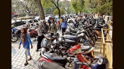 Parked two-wheelers block a footpath near the BMC headquarters in Mumbai. (HT Photo) Parked two-wheelers block a footpath near the BMC headquarters in Mumbai. (HT Photo)