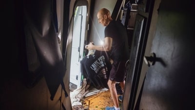 Thomas Rux, a resident of Riverside RV Park, goes through the wreckage of his RV that was swept away by floodwaters in Ingram, Texas, on Friday. (AP) Thomas Rux, a resident of Riverside RV Park, goes through the wreckage of his RV that was swept away by floodwaters in Ingram, Texas, on Friday. (AP)
