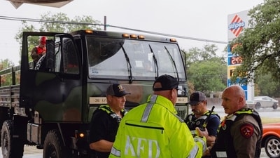 Members the Kerrville Fire Department and Texas Department of Public Safety refuel trucks after deadly flooding in Kerrville, Texas. (AP) Members the Kerrville Fire Department and Texas Department of Public Safety refuel trucks after deadly flooding in Kerrville, Texas. (AP)