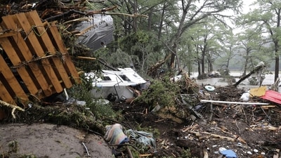 Debris is left behind by a raging Guadalupe River in Kerville, Texas (AP) Debris is left behind by a raging Guadalupe River in Kerville, Texas (AP)
