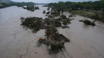 A raging Guadalupe River leaves fallen trees and debris in its wake in Kerrville, Texas. (AP Photo/Eric Gay) A raging Guadalupe River leaves fallen trees and debris in its wake in Kerrville, Texas. (AP Photo/Eric Gay)