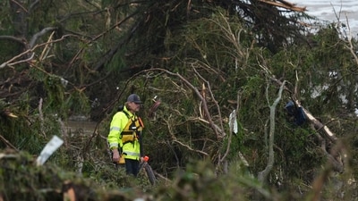A first responder searches an area along the Guadalupe River that was hit by flash flooding in Kerrville, Texas. (AP Photo/Eric Gay) A first responder searches an area along the Guadalupe River that was hit by flash flooding in Kerrville, Texas. (AP Photo/Eric Gay)