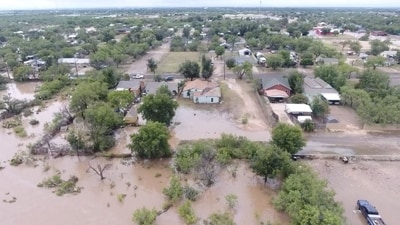 A drone view shows fallen trees, as a result of flash flooding, in Comfort, Texas. (REUTERS/Marco Bello)