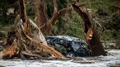 A car is caught between trees in the Guadalupe River after deadly flooding in Kerr County, Texas, US, July 5, 2025. (REUTERS/Sergio Flores)