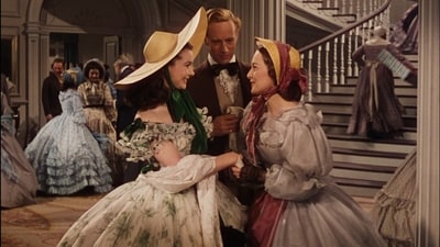 Vivien Leigh and Olivia de Havilland in a still from the world's most profitable film. Vivien Leigh and Olivia de Havilland in a still from the world's most profitable film.