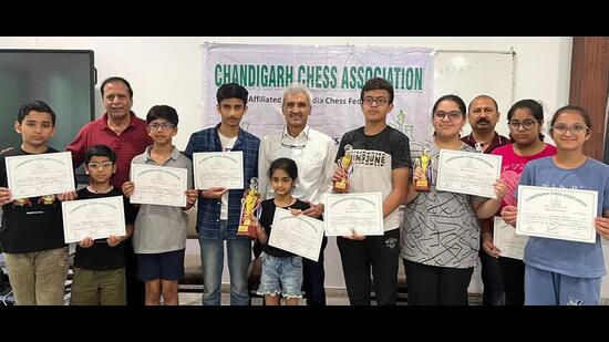 Chandigarh Chess Association president Manbir Singh felicitated the winners. (HT)