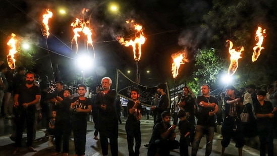 Muharram 2025: Devotees participate in a religious procession on the eighth day of Muharram at Dariya Wali Masjid in Lucknow on Friday. (Naeem Ansari)