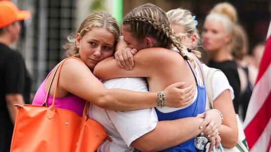 Campers embrace after arriving to a reunification area as girls from Camp Waldemar, near the North fork of the Guadalupe River, are reconnected with their families after heavy rainfall in Central Texas, Saturday, July 5, 2025.(AP)