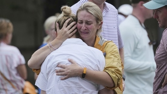 Families are reunited at a reunification center after flash flooding hit the area, Friday, July 4, 2025, in Ingram, Texas.(AP Photo/Eric Gay)