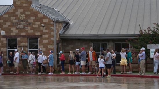 Families line up at a reunification center after flash flooding it the areain Ingram, Texas.(AP Photo/Eric Gay)