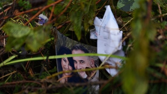 A family portrait is caught in debris along the Guadalupe River after a flash flood struck the area.(AP Photo/Eric Gay)