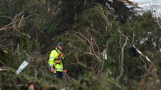 A first responder searches an area along the Guadalupe River that was hit by flash flooding in Kerrville, Texas.(AP Photo/Eric Gay)