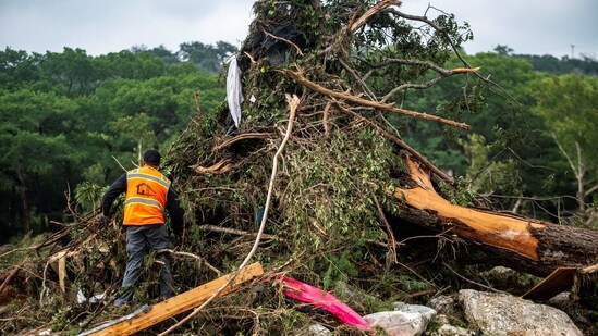 A volunteer rescue worker works after deadly flooding in Kerr County, Texas.(REUTERS/Sergio Flores)