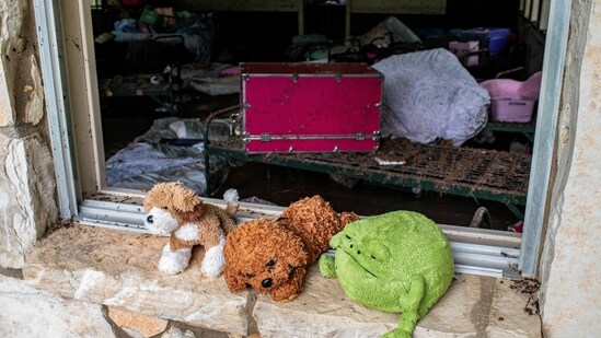 Stuffed animals sit in a windowsill at Camp Mystic after a deadly flooding in Kerr County, Texas, US, July 5, 2025.(REUTERS/Sergio Flores)