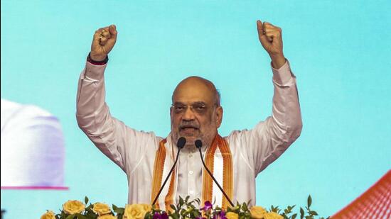 Union minister Amit Shah addresses a gathering during an event to mark the fourth foundation day of the Ministry of Cooperation and the 150th birth anniversary year of Sardar Vallabhbhai Patel, at the campus of Amul Dairy in Anand, Gujarat, Sunday. (PTI)