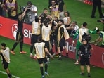Mexico midfielder Edson Alvarez (4) celebrates with teammates after scoring a goal against the United States 