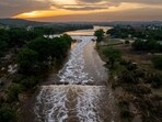 KERRVILLE, TEXAS - JULY 06: In an aerial view, the sun sets over the Guadalupe River on July 06, 2025 in Kerrville, Texas. Heavy rainfall caused severe flooding along the Guadalupe River in central Texas, leaving more than 80 people reported dead. Brandon Bell/Getty Images/AFP (Photo by Brandon Bell / GETTY IMAGES NORTH AMERICA / Getty Images via AFP) KERRVILLE, TEXAS - JULY 06: In an aerial view, the sun sets over the Guadalupe River on July 06, 2025 in Kerrville, Texas. Heavy rainfall caused severe flooding along the Guadalupe River in central Texas, leaving more than 80 people reported dead. Brandon Bell/Getty Images/AFP (Photo by Brandon Bell / GETTY IMAGES NORTH AMERICA / Getty Images via AFP)