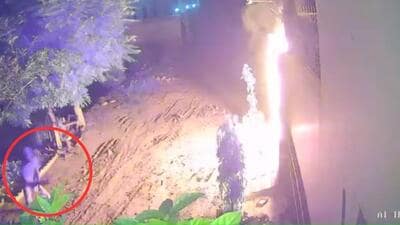 CCTV footage shows a man hurling an explosive at the house and its gate on fire in Jalandhar’s Adampur town early on Monday.