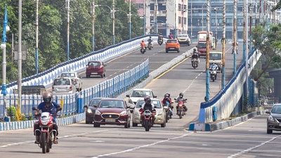 Vehicles on a flyover after easing of restrictions of Covid-19 lockdown, in Kolkata on Tuesday. (PTI Photo) Vehicles on a flyover after easing of restrictions of Covid-19 lockdown, in Kolkata on Tuesday. (PTI Photo)