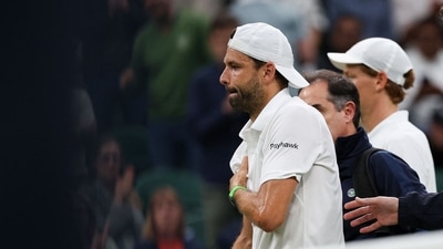 Bulgaria's Grigor Dimitrov (L) reacts after getting injured as he plays against Italy's Jannik Sinner during their men's singles fourth round tennis match on the eighth day of the 2025 Wimbledon Championships at The All England Lawn Tennis and Croquet Club in Wimbledon, southwest London, on July 7, 2025. (Photo by Adrian Dennis / AFP) / RESTRICTED TO EDITORIAL USE (AFP) Bulgaria's Grigor Dimitrov (L) reacts after getting injured as he plays against Italy's Jannik Sinner during their men's singles fourth round tennis match on the eighth day of the 2025 Wimbledon Championships at The All England Lawn Tennis and Croquet Club in Wimbledon, southwest London, on July 7, 2025. (Photo by Adrian Dennis / AFP) / RESTRICTED TO EDITORIAL USE (AFP)