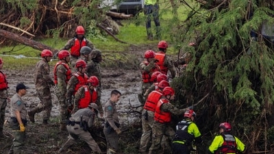 Search and recovery workers dig through debris looking for any survivors or remains of people swept up in the flash flooding at Camp Mystic on July 6, 2025 in Hunt, Texas. (Getty Images via AFP) Search and recovery workers dig through debris looking for any survivors or remains of people swept up in the flash flooding at Camp Mystic on July 6, 2025 in Hunt, Texas. (Getty Images via AFP)