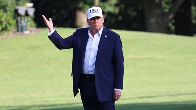 US President Donald Trump stops to gesture at the US flag as he walks on the South Lawn from Marine One to the White House in Washington, DC on July 6 (AFP) US President Donald Trump stops to gesture at the US flag as he walks on the South Lawn from Marine One to the White House in Washington, DC on July 6 (AFP)