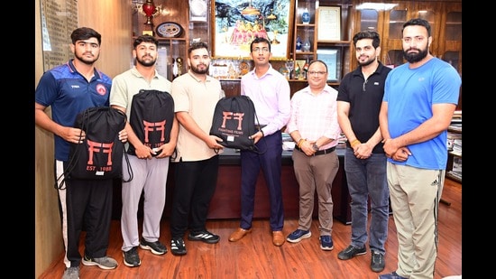 Anshul Garg, chief executive officer, SMVDSB, presenting internationally approved judo kits to the judokas in the presence of Satish Sharma, joint chief executive officer, Dhruv Gupta, director (Sports), SMVD Sports Complex and Danish Sharma, judo coach at Central Office, Katra. (HT Photo)
